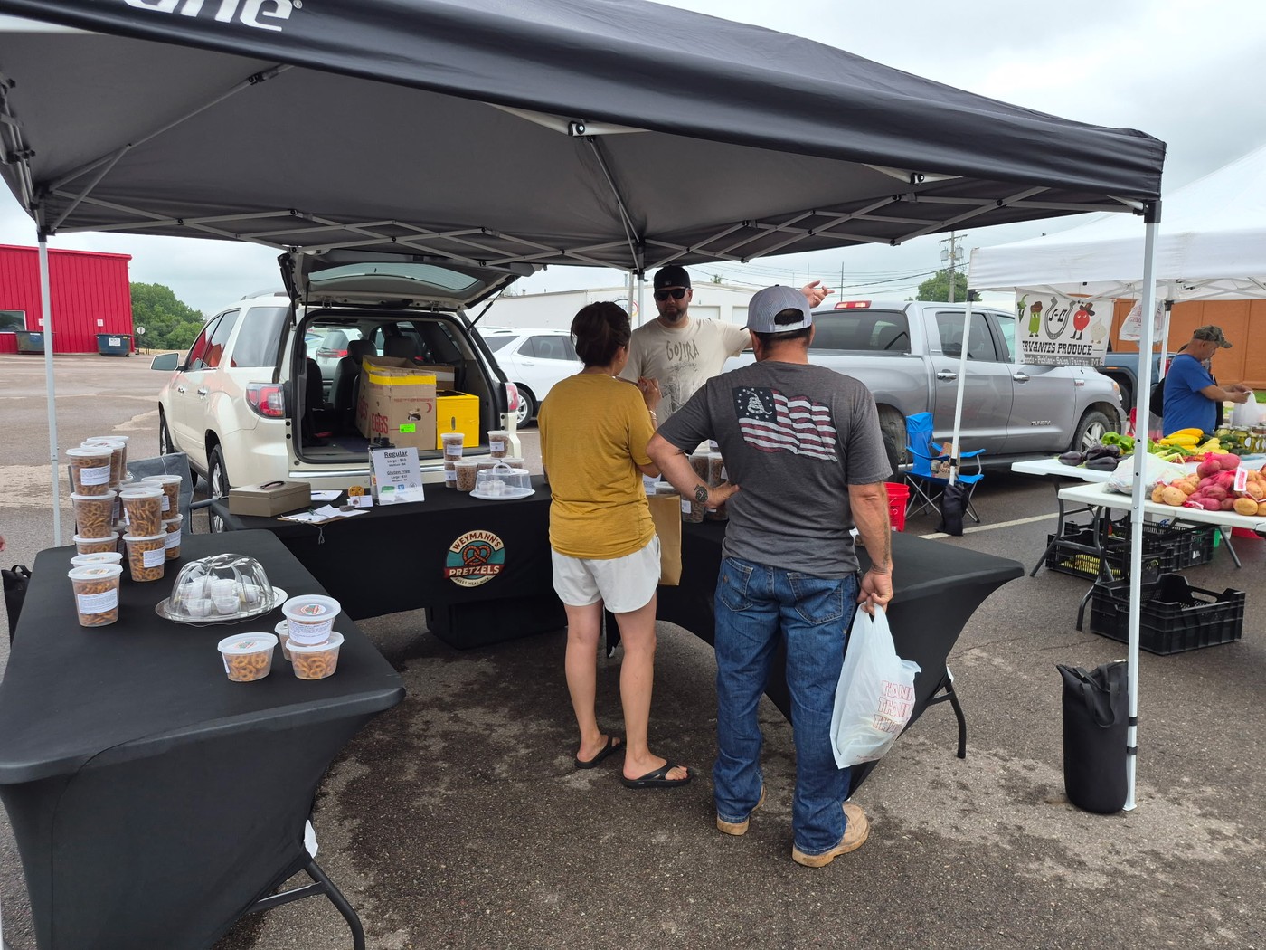 Chris Weymann talking with customers at the Weymann’s Pretzels booth