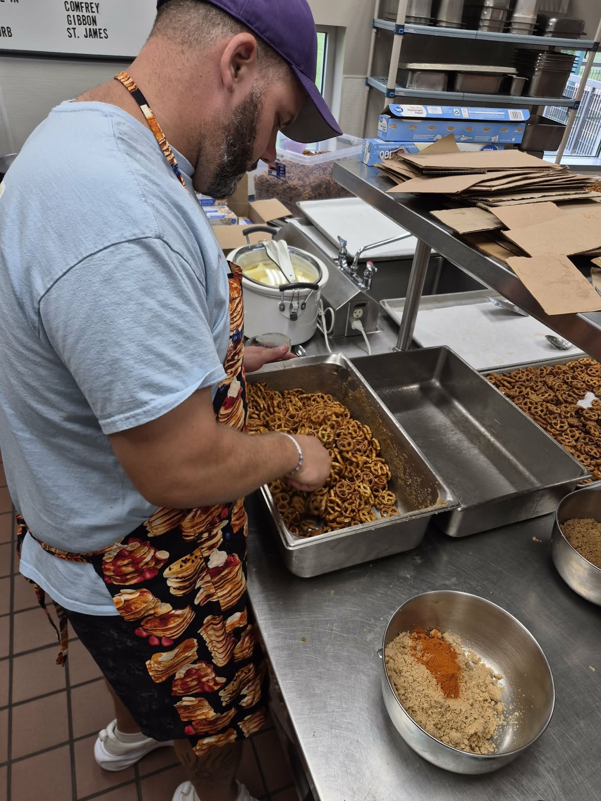 Chris Weymann mixing a fresh batch of seasoned pretzels